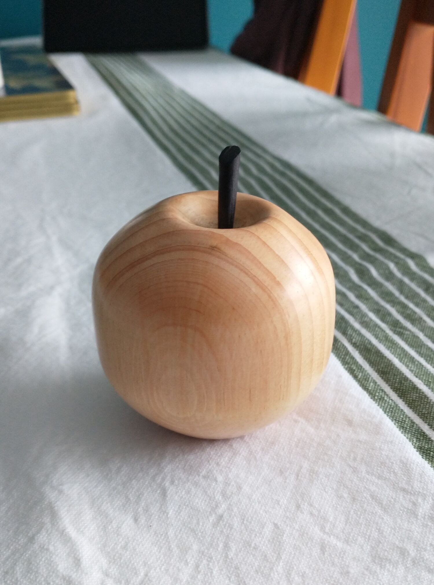 Simple ceramic bowl on wooden shelf