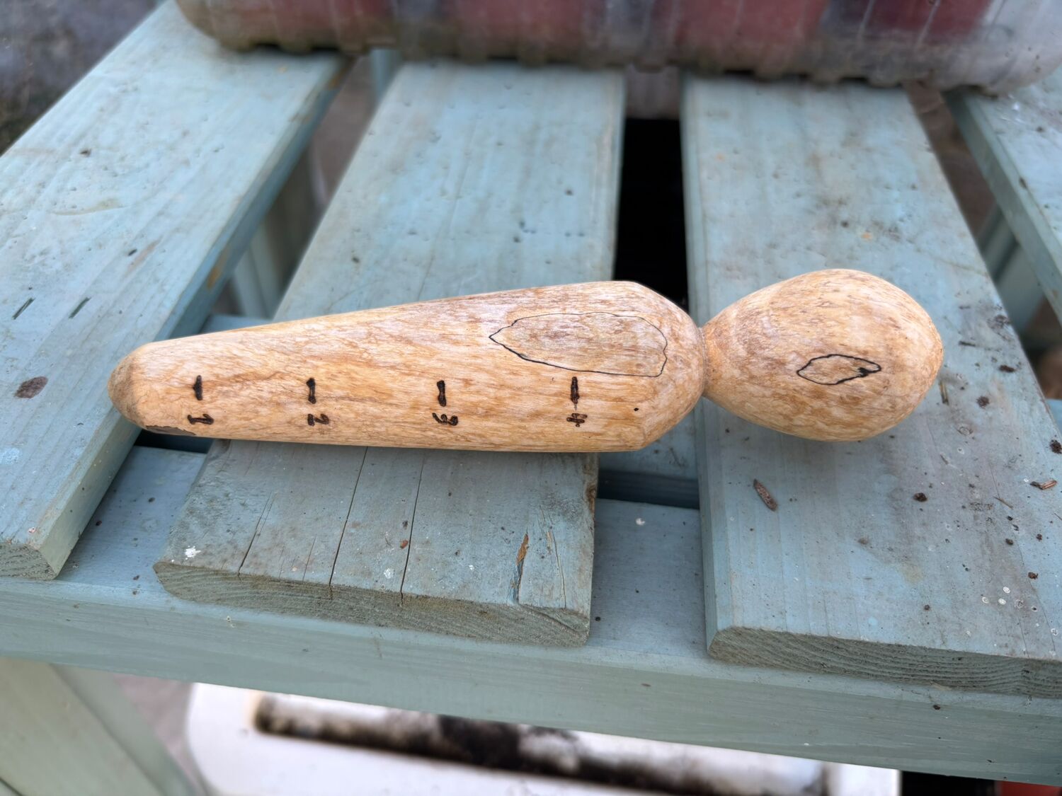 Craftsman using lathe on carved wooden plank