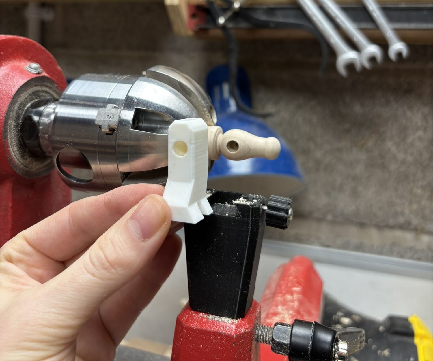 Craftsman using wood lathe in workshop