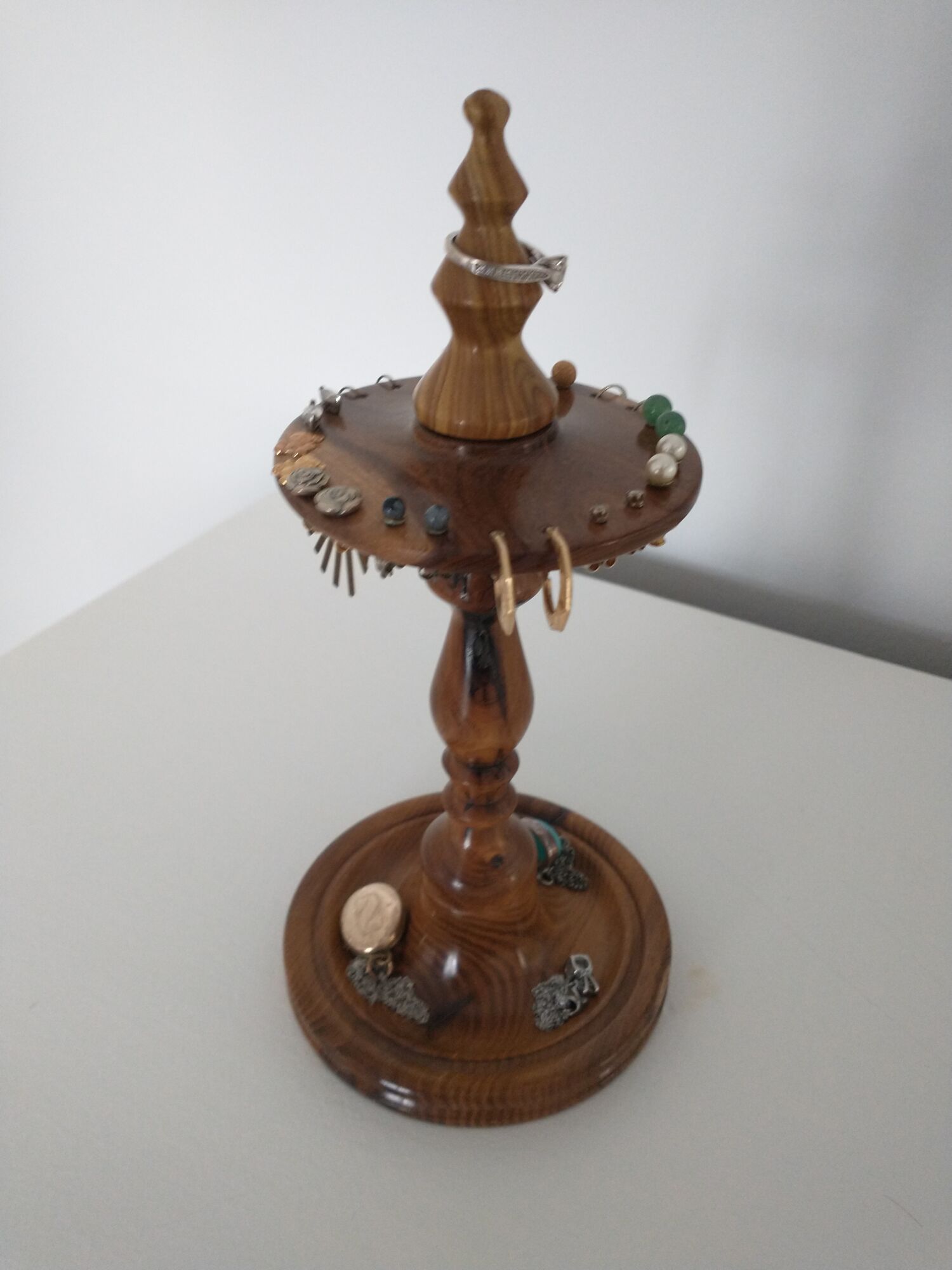 Handcrafted ceramic pots on wooden shelves