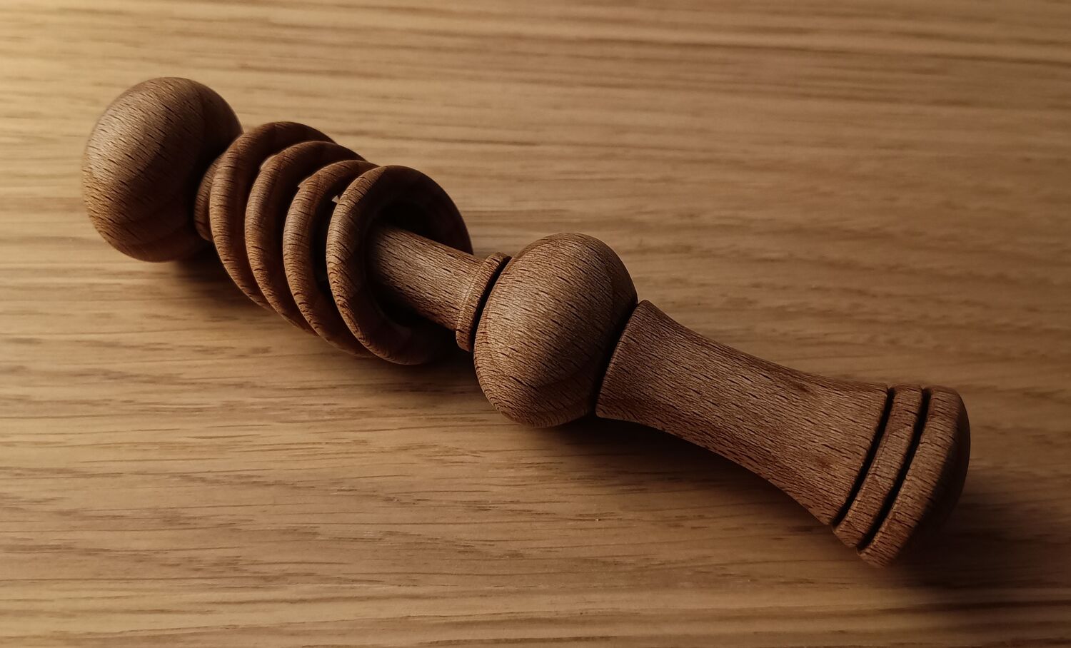 Artisan using lathe in woodworking workshop