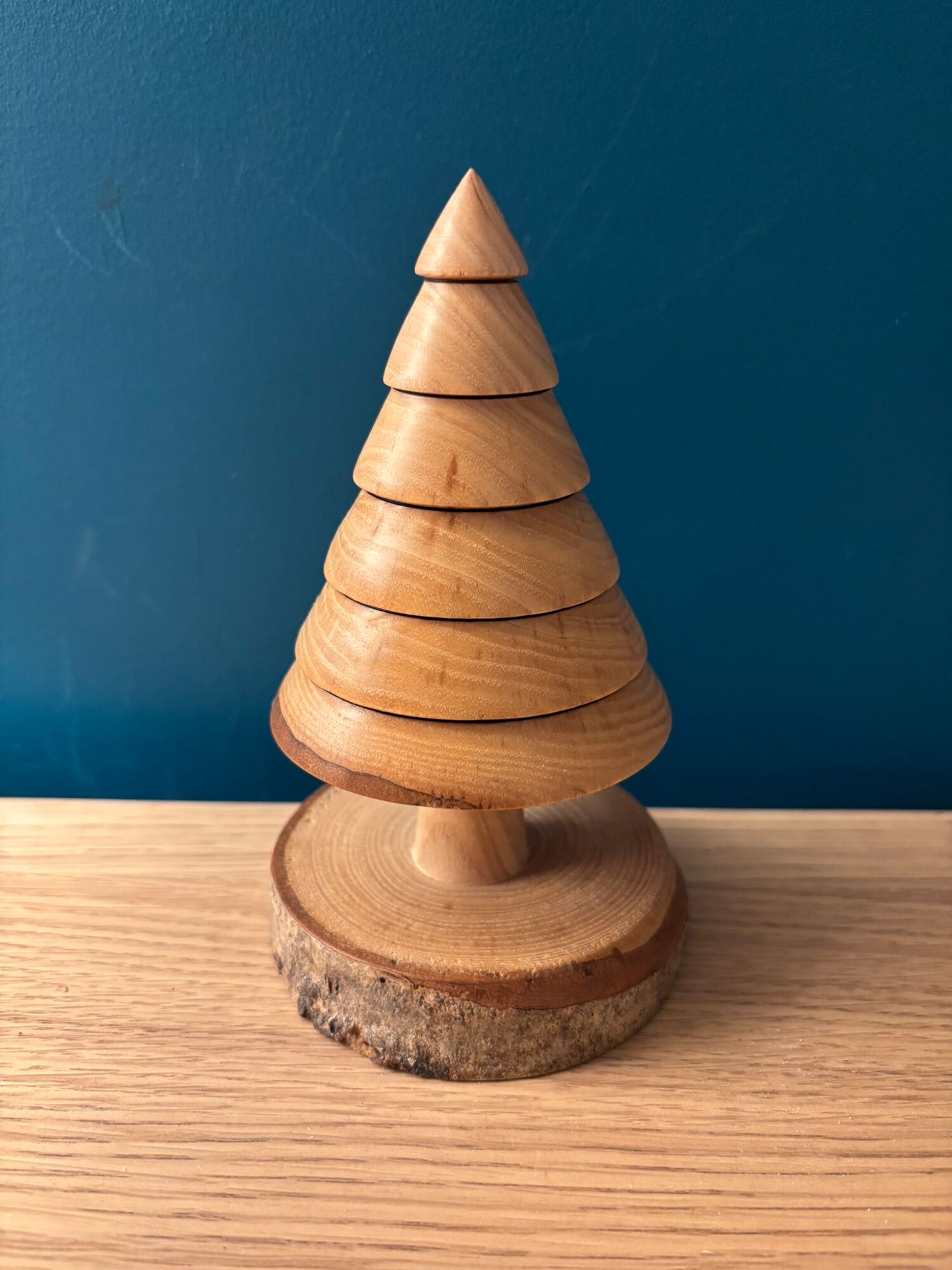 Artisan using lathe in woodworking workshop